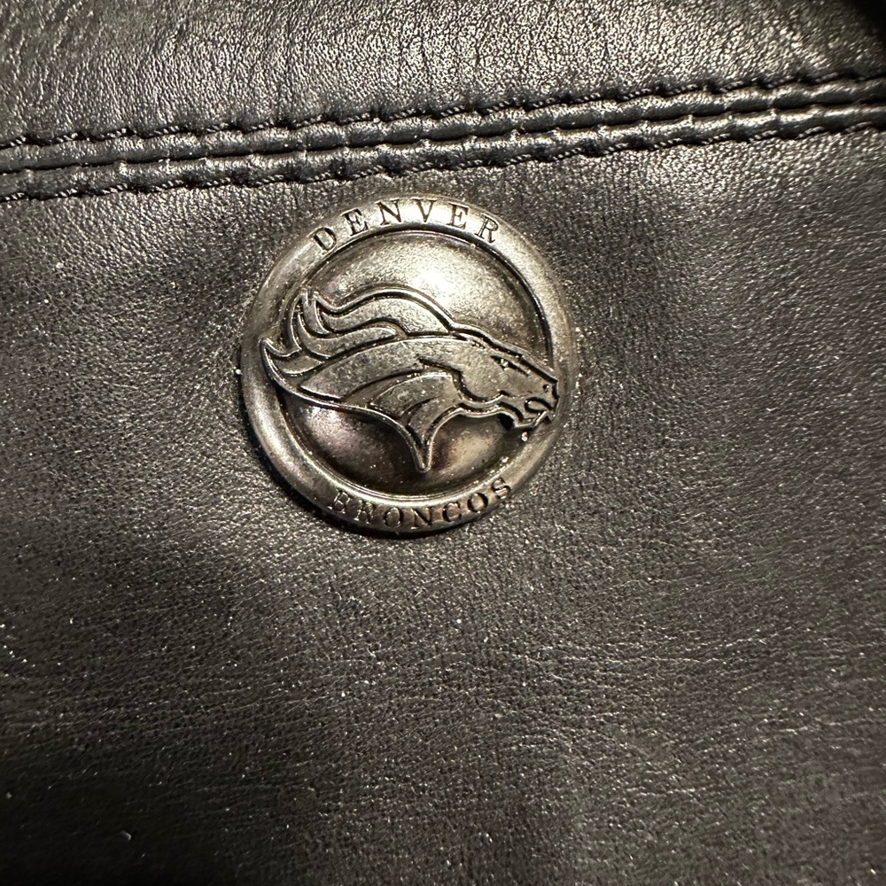 Black Leather Bag with Silver Emblem and Quality Stitching